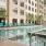 lounge chairs flank outdoor swimming pool