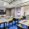 garage door opens in game room with tv viewing area, game tables and arcade game