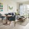 well lit living room open to kitchen