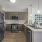 Model Apartment at One North of Boston Apartments in Chelsea MA showing peninsula kitchen and dark coffee style cabinets in our model